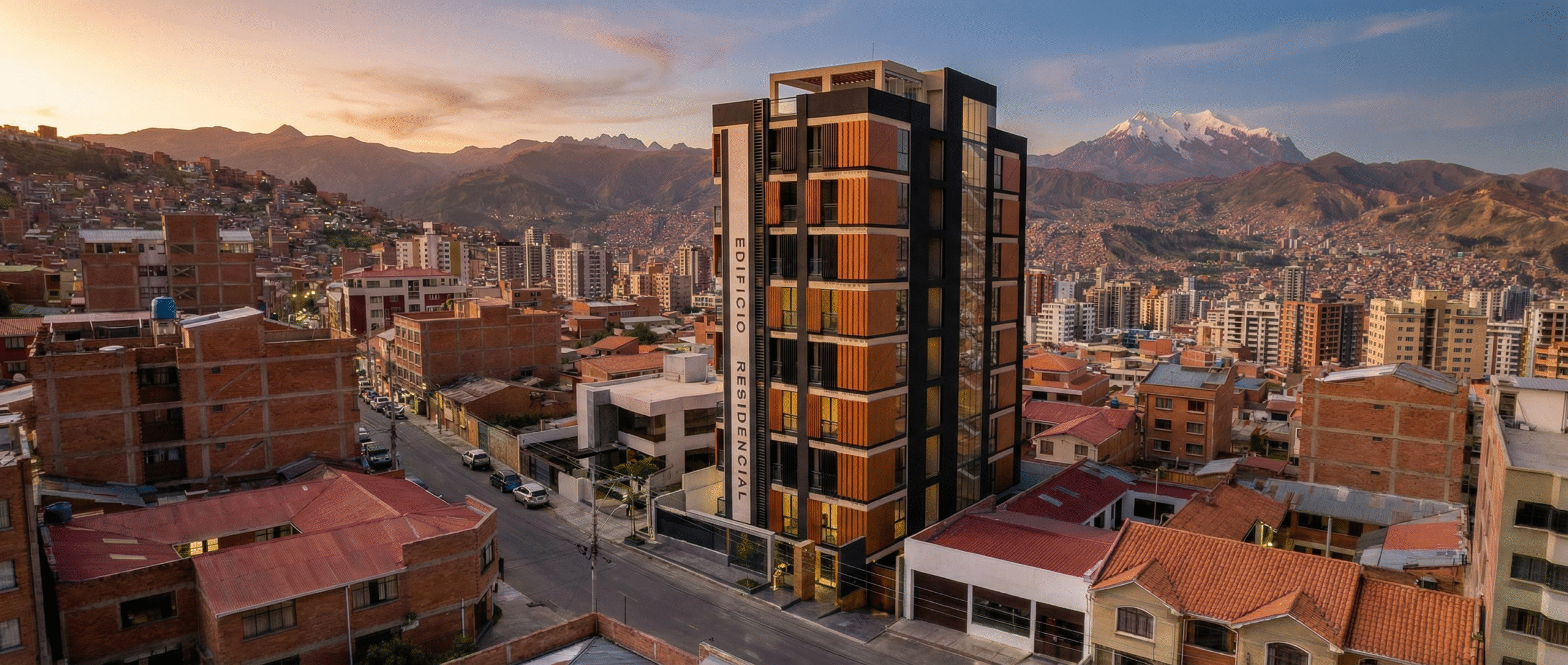 Edificio multifamiliar en La Paz al atardecer con el Illimani de fondo